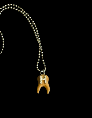 Rotten Initial Tooth necklace